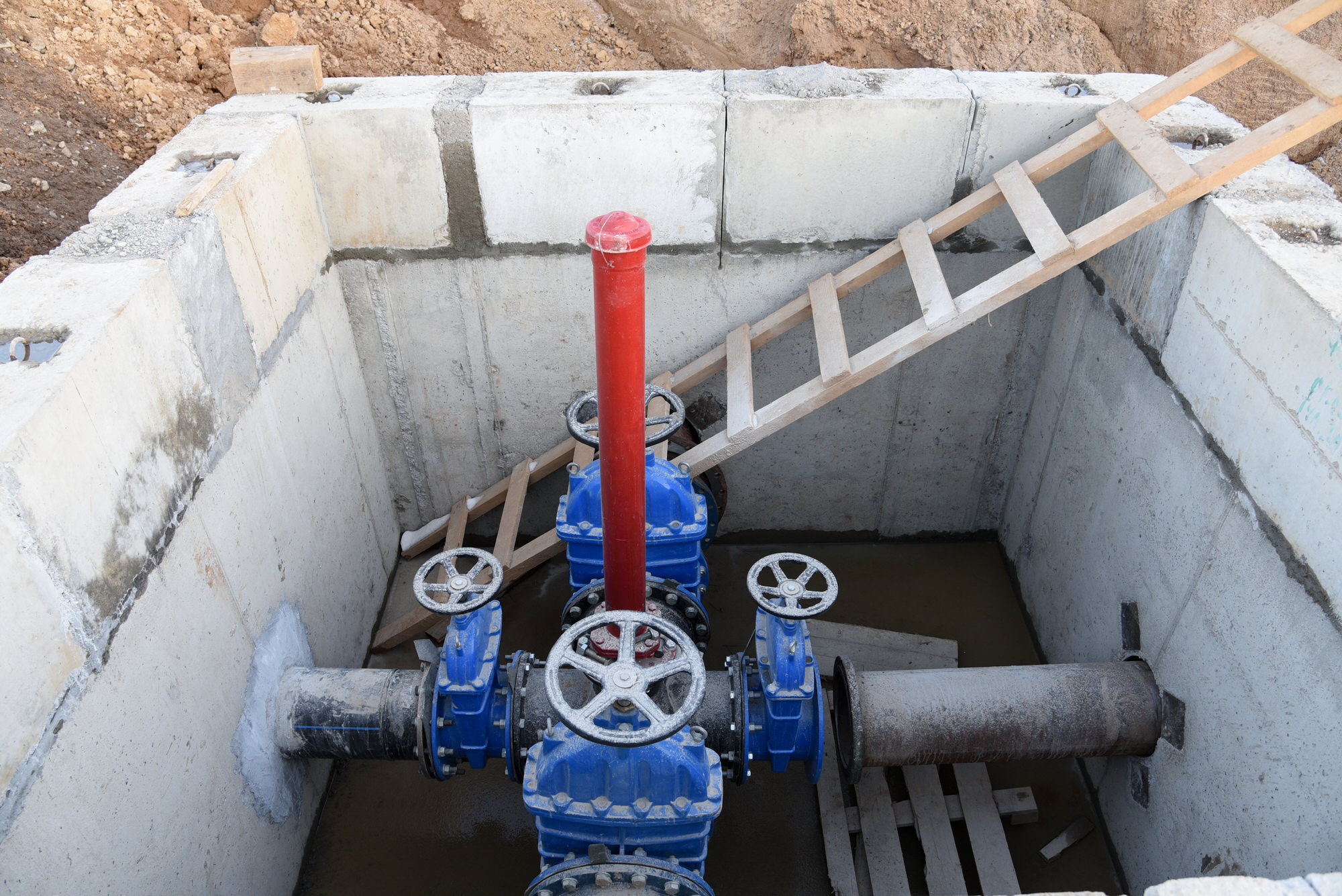 Gate valves in valve pit of the underground piping networks